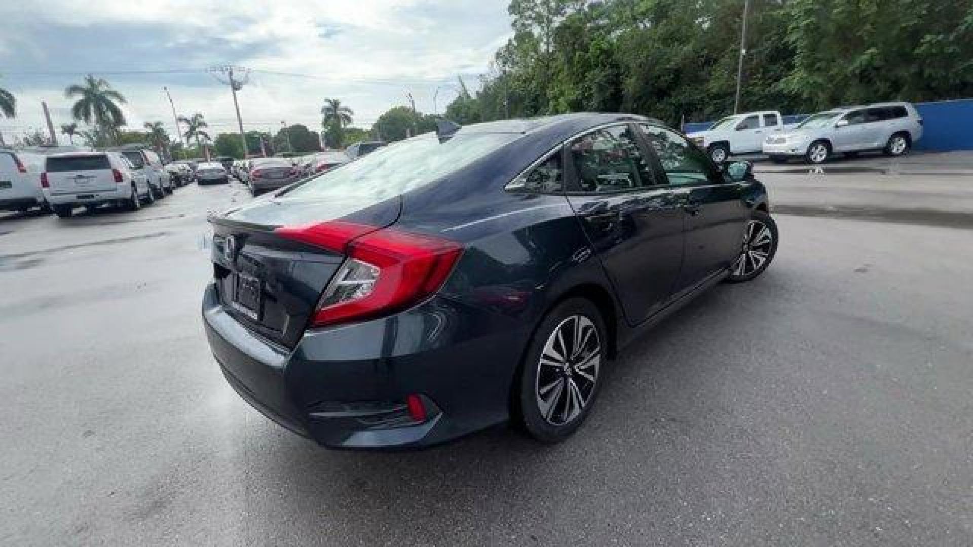 2016 Gray Honda Civic Sedan EX-T (19XFC1F30GE) with an 4 1.5 L engine, Variable transmission, located at 27610 S Dixie Hwy, Homestead, FL, 33032, (305) 749-2348, 25.510241, -80.438301 - IIHS Top Safety Pick+. Delivers 42 Highway MPG and 31 City MPG! This Honda Civic Sedan delivers a Intercooled Turbo Regular Unleaded I-4 1.5 L/91 engine powering this Variable transmission. Wheels: 17 Alloy, Wheels w/Silver Accents, VSA Electronic Stability Control (ESC).*This Honda Civic Sedan Come - Photo#4