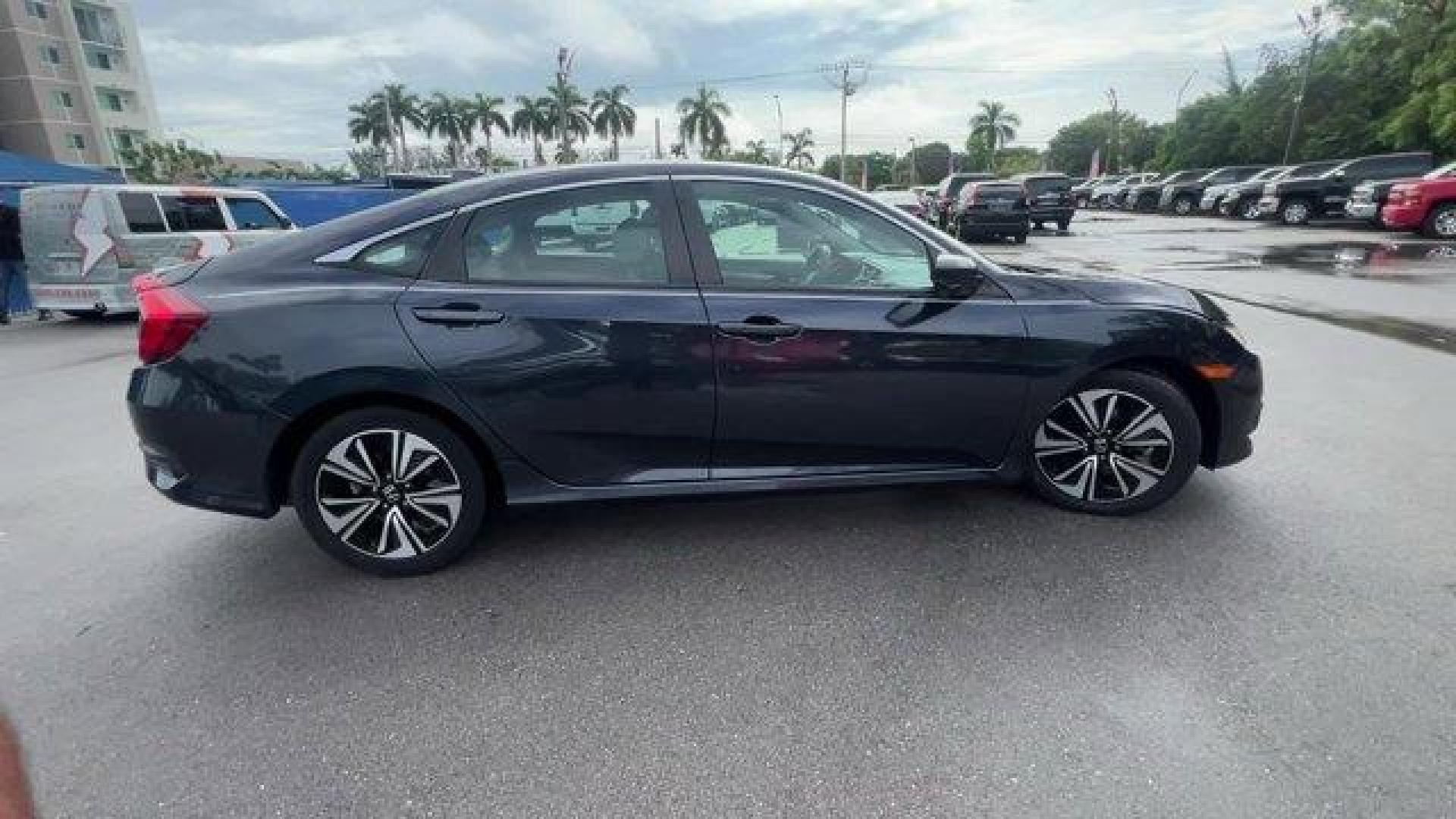 2016 Gray Honda Civic Sedan EX-T (19XFC1F30GE) with an 4 1.5 L engine, Variable transmission, located at 27610 S Dixie Hwy, Homestead, FL, 33032, (305) 749-2348, 25.510241, -80.438301 - IIHS Top Safety Pick+. Delivers 42 Highway MPG and 31 City MPG! This Honda Civic Sedan delivers a Intercooled Turbo Regular Unleaded I-4 1.5 L/91 engine powering this Variable transmission. Wheels: 17 Alloy, Wheels w/Silver Accents, VSA Electronic Stability Control (ESC).*This Honda Civic Sedan Come - Photo#5