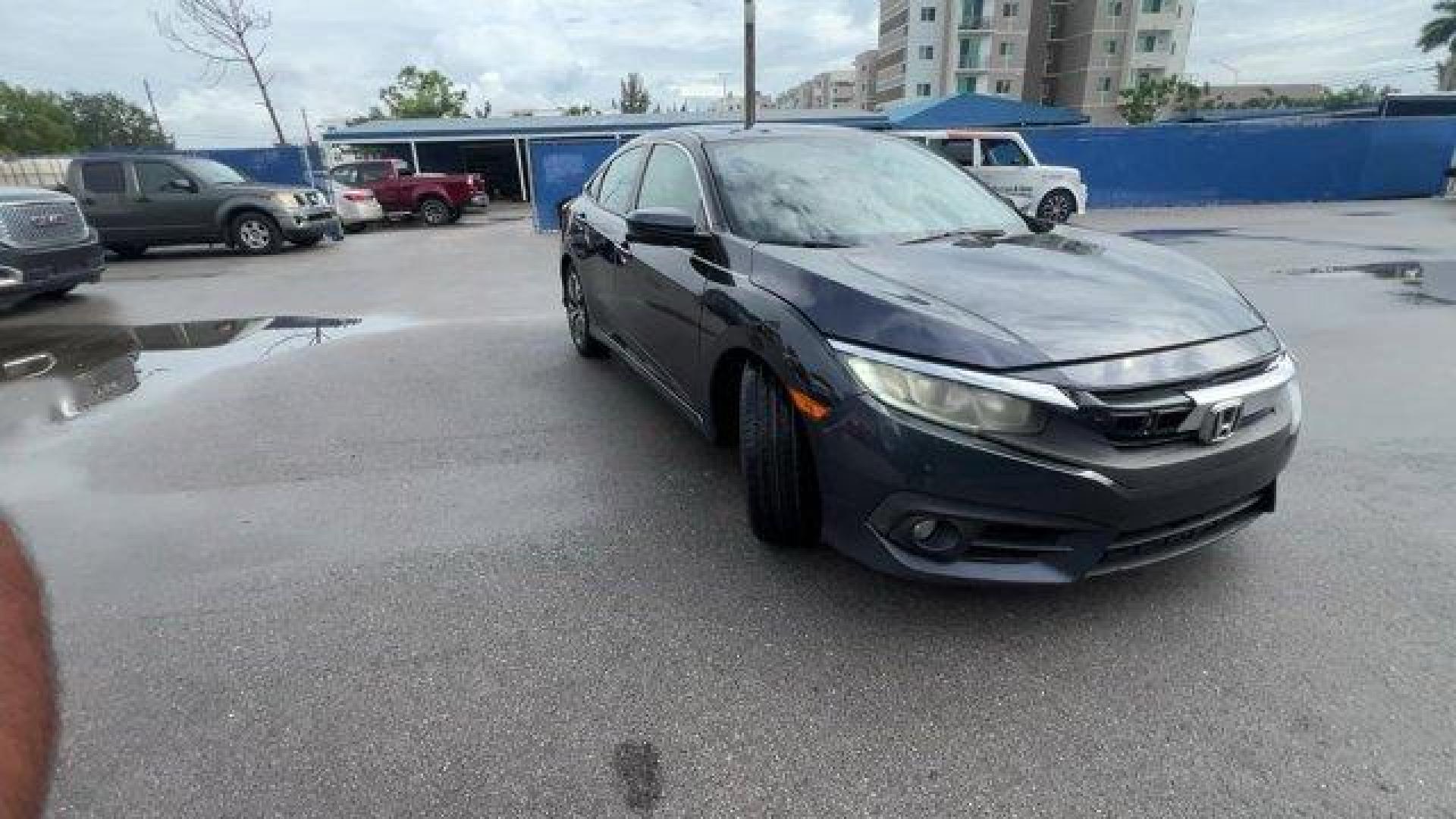 2016 Gray Honda Civic Sedan EX-T (19XFC1F30GE) with an 4 1.5 L engine, Variable transmission, located at 27610 S Dixie Hwy, Homestead, FL, 33032, (305) 749-2348, 25.510241, -80.438301 - IIHS Top Safety Pick+. Delivers 42 Highway MPG and 31 City MPG! This Honda Civic Sedan delivers a Intercooled Turbo Regular Unleaded I-4 1.5 L/91 engine powering this Variable transmission. Wheels: 17 Alloy, Wheels w/Silver Accents, VSA Electronic Stability Control (ESC).*This Honda Civic Sedan Come - Photo#6