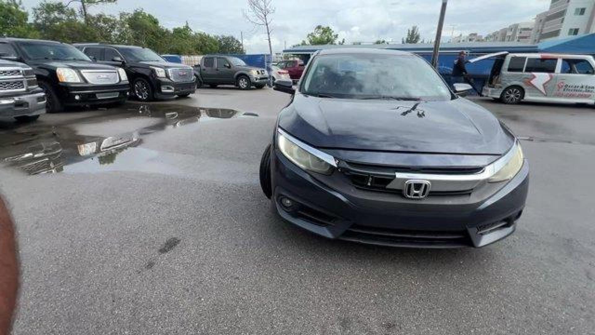 2016 Gray Honda Civic Sedan EX-T (19XFC1F30GE) with an 4 1.5 L engine, Variable transmission, located at 27610 S Dixie Hwy, Homestead, FL, 33032, (305) 749-2348, 25.510241, -80.438301 - IIHS Top Safety Pick+. Delivers 42 Highway MPG and 31 City MPG! This Honda Civic Sedan delivers a Intercooled Turbo Regular Unleaded I-4 1.5 L/91 engine powering this Variable transmission. Wheels: 17 Alloy, Wheels w/Silver Accents, VSA Electronic Stability Control (ESC).*This Honda Civic Sedan Come - Photo#7