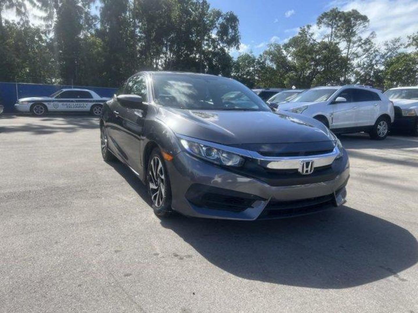 2018 Gray Honda Civic Coupe LX-P (2HGFC4B0XJH) with an 4 2.0 L engine, Variable transmission, located at 27610 S Dixie Hwy, Homestead, FL, 33032, (305) 749-2348, 25.510241, -80.438301 - KBB.com 10 Most Awarded Brands. Only 52,044 Miles! Delivers 39 Highway MPG and 30 City MPG! This Honda Civic Coupe delivers a Regular Unleaded I-4 2.0 L/122 engine powering this Variable transmission. Wheels: 16 Alloy, Wheels w/Machined w/Painted Accents Accents, VSA Electronic Stability Control (ES - Photo#0