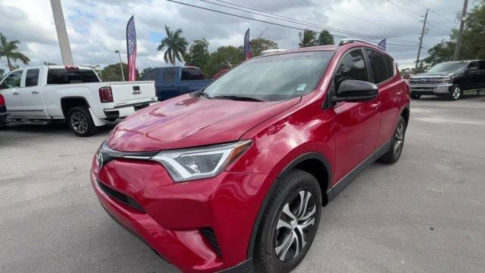 2016 Red Toyota RAV4 LE (JTMZFREV1GJ) with an 4 2.5 L engine, Automatic transmission, located at 27610 S Dixie Hwy, Homestead, FL, 33032, (305) 749-2348, 25.510241, -80.438301 - IIHS Top Safety Pick+. Scores 30 Highway MPG and 23 City MPG! This Toyota RAV4 delivers a Regular Unleaded I-4 2.5 L/152 engine powering this Automatic transmission. Wheels: 17 x 6.5J -inc: caps, Urethane Gear Shifter Material, Trip Computer.*This Toyota RAV4 Comes Equipped with These Options *Trans - Photo#0