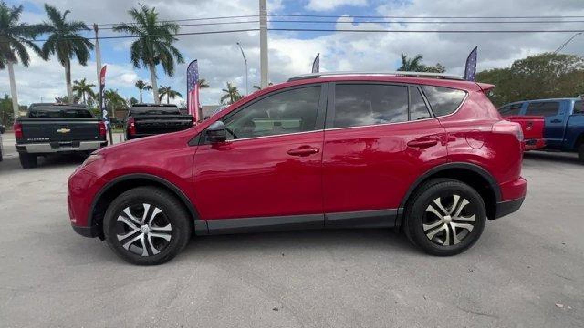 2016 Red Toyota RAV4 LE (JTMZFREV1GJ) with an 4 2.5 L engine, Automatic transmission, located at 27610 S Dixie Hwy, Homestead, FL, 33032, (305) 749-2348, 25.510241, -80.438301 - IIHS Top Safety Pick+. Scores 30 Highway MPG and 23 City MPG! This Toyota RAV4 delivers a Regular Unleaded I-4 2.5 L/152 engine powering this Automatic transmission. Wheels: 17 x 6.5J -inc: caps, Urethane Gear Shifter Material, Trip Computer.*This Toyota RAV4 Comes Equipped with These Options *Trans - Photo#1